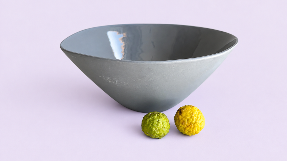 Grey Large Fruit Bowl on pale lilac background