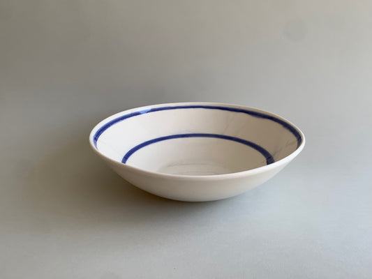 Cobalt blue line handmade porcelain salad bowl, side view