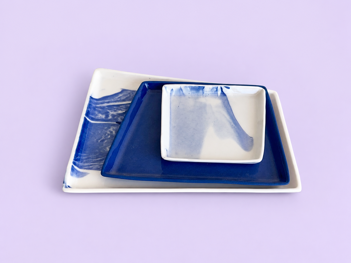 Trio servingware — original blue and white porcelain, soft solid background 1